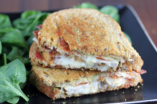 Dijon chicken grilled cheese sandwich cut in half