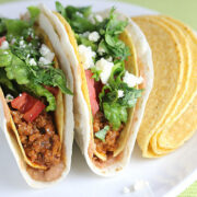 Double decker tacos served with crispy shells on the side