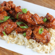 Spicy dragon chicken pieces on a bed of rice