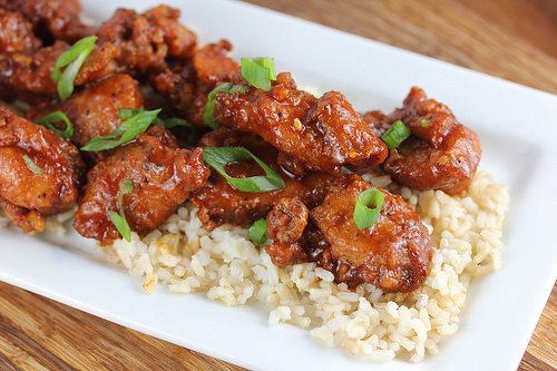 Spicy dragon chicken pieces on a bed of rice