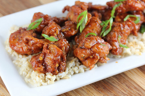 Dragon chicken served over rice with green onions
