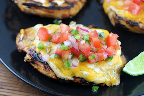 Grilled fiesta lime chicken with cheese and tomato salsa