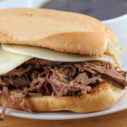 Close up of French dip sandwich with melted cheese