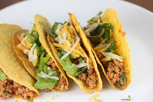Ground chicken tacos with cheese and lettuce