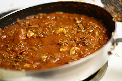 Simmering Italian meat sauce in a skillet