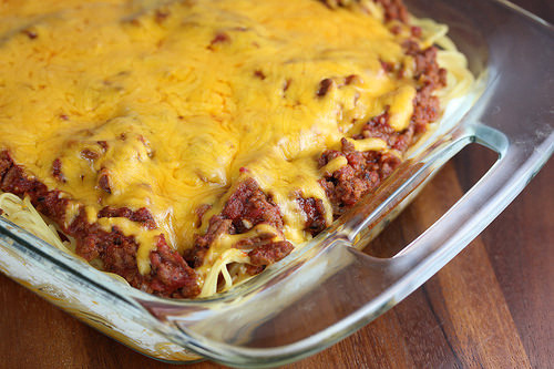 Baked spaghetti casserole with golden cheese topping