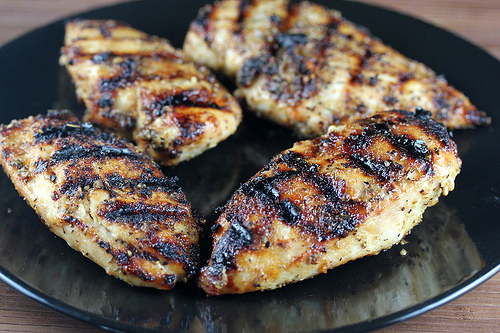 Grilled Montreal chicken breasts on plate