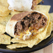 Cheesy beef burrito served with tortilla chips