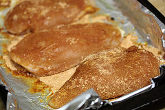 Pizza crusts baking on foil lined pan