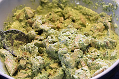 Creamy basil chicken salad mixed in bowl