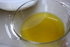 Homemade vinaigrette in glass measuring cup