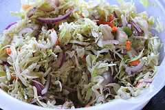 Shredded cabbage slaw in mixing bowl