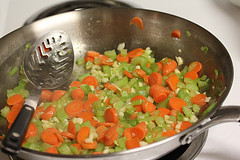 Sautéed carrots peas and celery in skillet