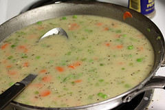 Creamy chicken casserole mixture cooking on stove