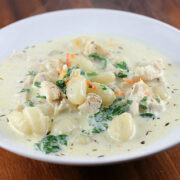 Chicken gnocchi soup with spinach and herbs
