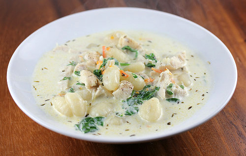 Chicken gnocchi soup with spinach and herbs