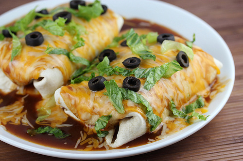 Chicken wet burritos covered in enchilada sauce