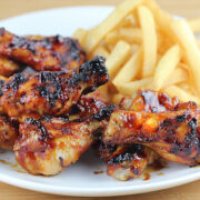 Sticky honey bbq wings on white plate