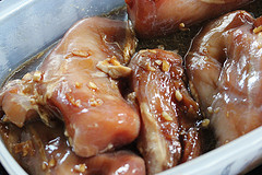 Chicken marinating in citrus sauce