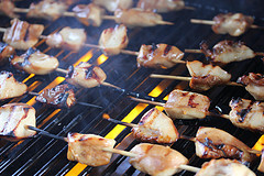 Key west chicken skewers grilling on barbecue