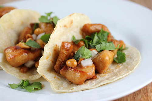 Close up of kung pao chicken taco