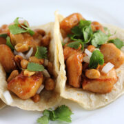Kung pao chicken tacos on corn tortillas