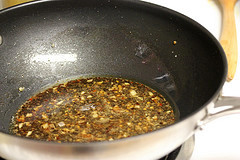 Kung pao sauce cooking in skillet