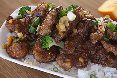 Orange beef served over rice with scallions