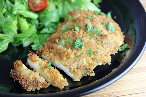 Panko crusted chicken breast served with leafy green salad