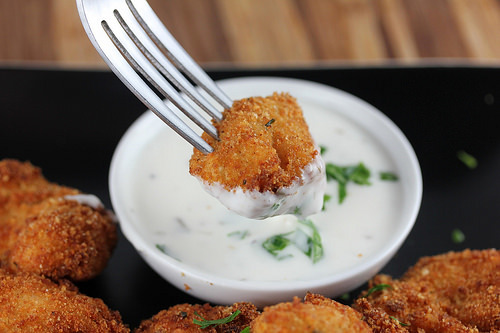 Golden parmesan ranch chicken bites served with dipping sauce