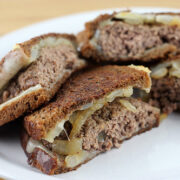 Instructions In a large skillet melt 4 tablespoons of butter over medium-high heat. Add onions and sauté until lightly browned. Remove from the pan and set aside. Form ground beef into 4 patties. Season on both sides with salt and pepper. Place into the skillet and cook hamburger patties over medium-high heat until the burgers are fully cooked (they have reached an internal temperature of 160 degrees). Heat another skillet to medium heat. Butter one side of the bread. Put the buttered side down on the hot skillet. Place 1 slice of cheese followed by onions, then add the cooked patty and top with another slice of cheese. Butter another slice of bread and place on the top buttered side out. Fry until the bread is browned and crisp on the bottom and turn over and fry until the other side is browned and crisp. The cheese should be melted. Repeat until all of the patty melts are cooked.