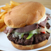 Beef patties cooking on a grill