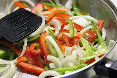 Philly cheesesteak burger with fries on a plate