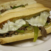 Close up of a cheesy Philly cheesesteak sandwich