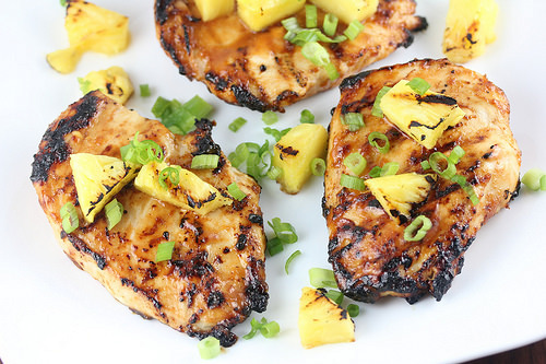 Pineapple grilled chicken breasts topped with green onions