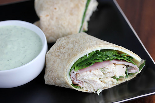 Chicken wrap drizzled with creamy ranch sauce