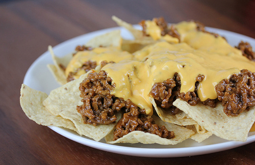 Sloppy Joe nachos topped with melted cheese