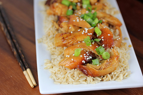 Asian chicken served over rice with green onions