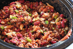 Slow cooker chili cooking with beans and ground beef