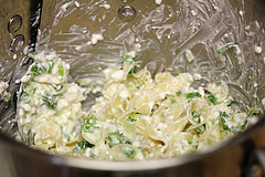 Creamy sour cream mixture with green onions in a bowl