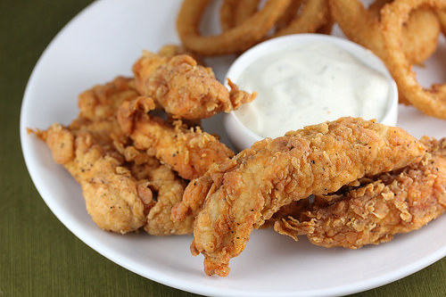 Crispy fried chicken strips with dipping sauce