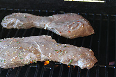 Steak grilling on barbecue grate