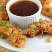 Sweet chili chicken strips on white plate
