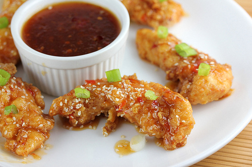 Glazed chicken strips with sesame and green onions