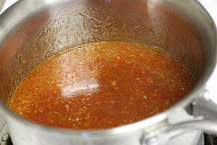 Sweet chili sauce simmering in saucepan