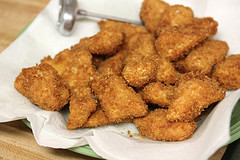 Crispy fried chicken pieces on paper towel