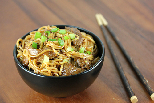Bowl of spicy szechuan noodles with chopsticks