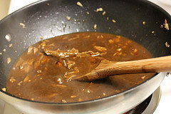 Szechuan sauce simmering in skillet