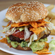 Taco burger with guacamole and crushed chips