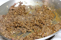 Seasoned ground beef cooking in skillet